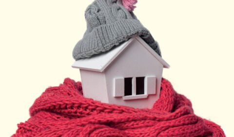 Image of toy house wrapped in blanket