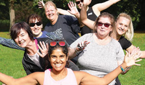 Group of exercisers in a park